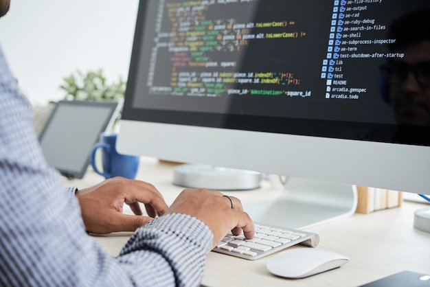 Developer coding on a computer