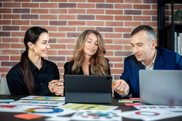 Business team meeting with laptops