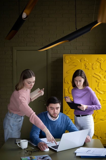Team working on laptop together