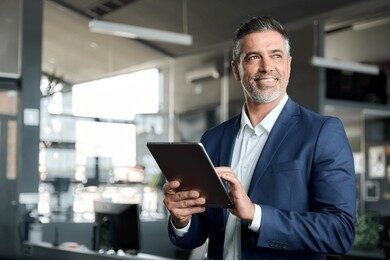 Businessman using tablet in office
