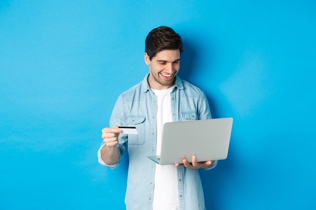 Man with laptop and credit card